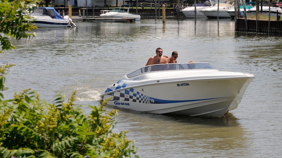 Southern Ontario featuring boating and a bay or harbor as well as a small group of people