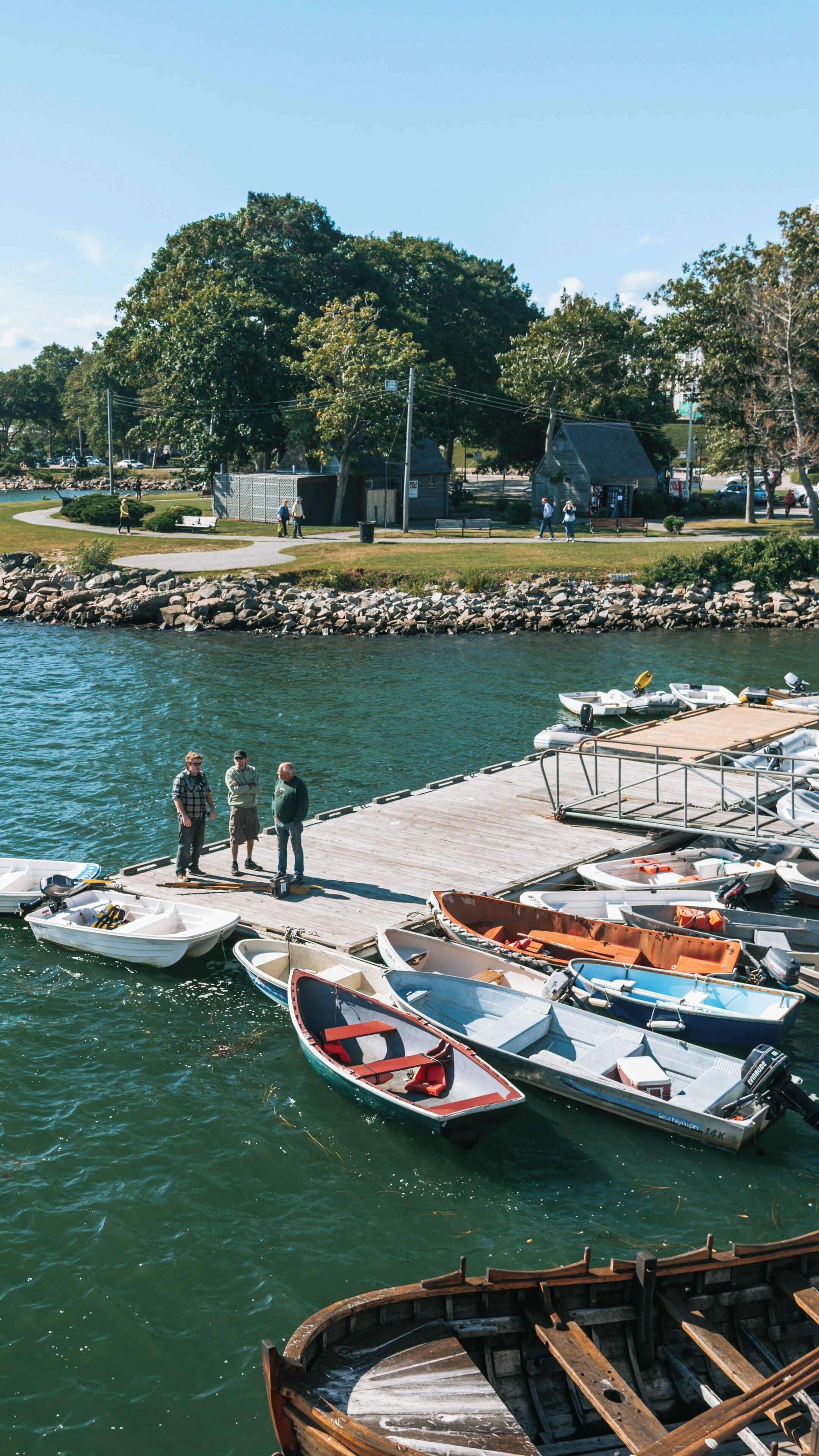 Beautiful Plymouth Harbor showcasing boats, visitors, and the vibrant Plymouth Cultural District in Massachusetts