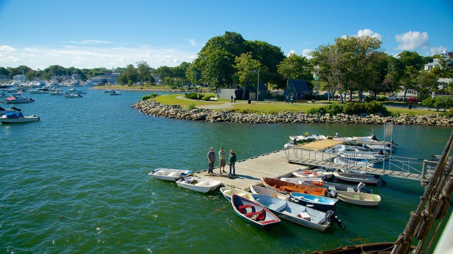 Plymouth Harbor featuring a bay or harbor as well as a small group of people