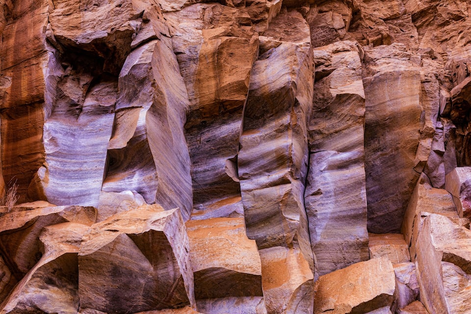 A canyon with layered rock formations.