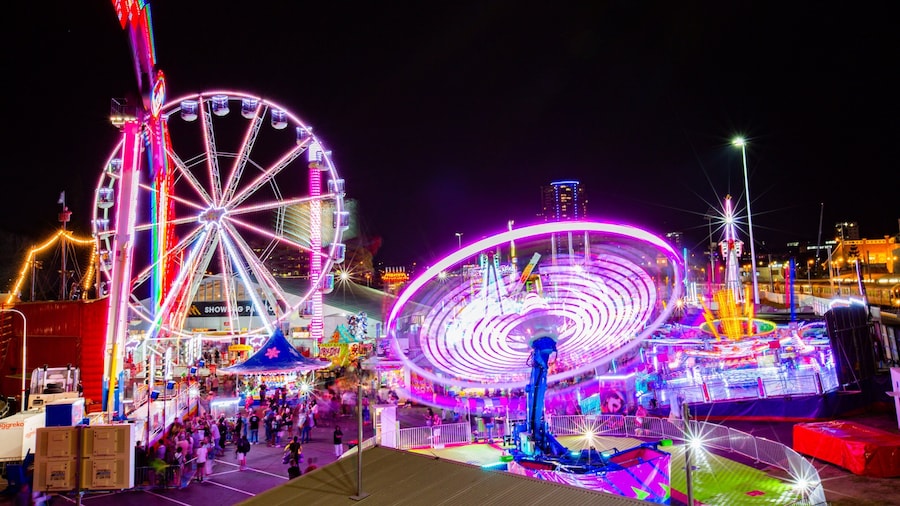 RNA Showgrounds featuring rides and night scenes