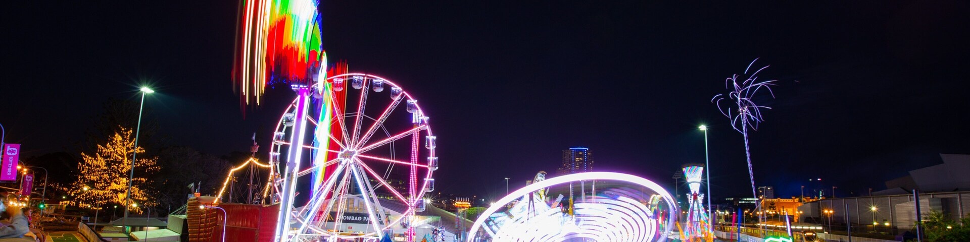 RNA Showgrounds which includes rides and night scenes