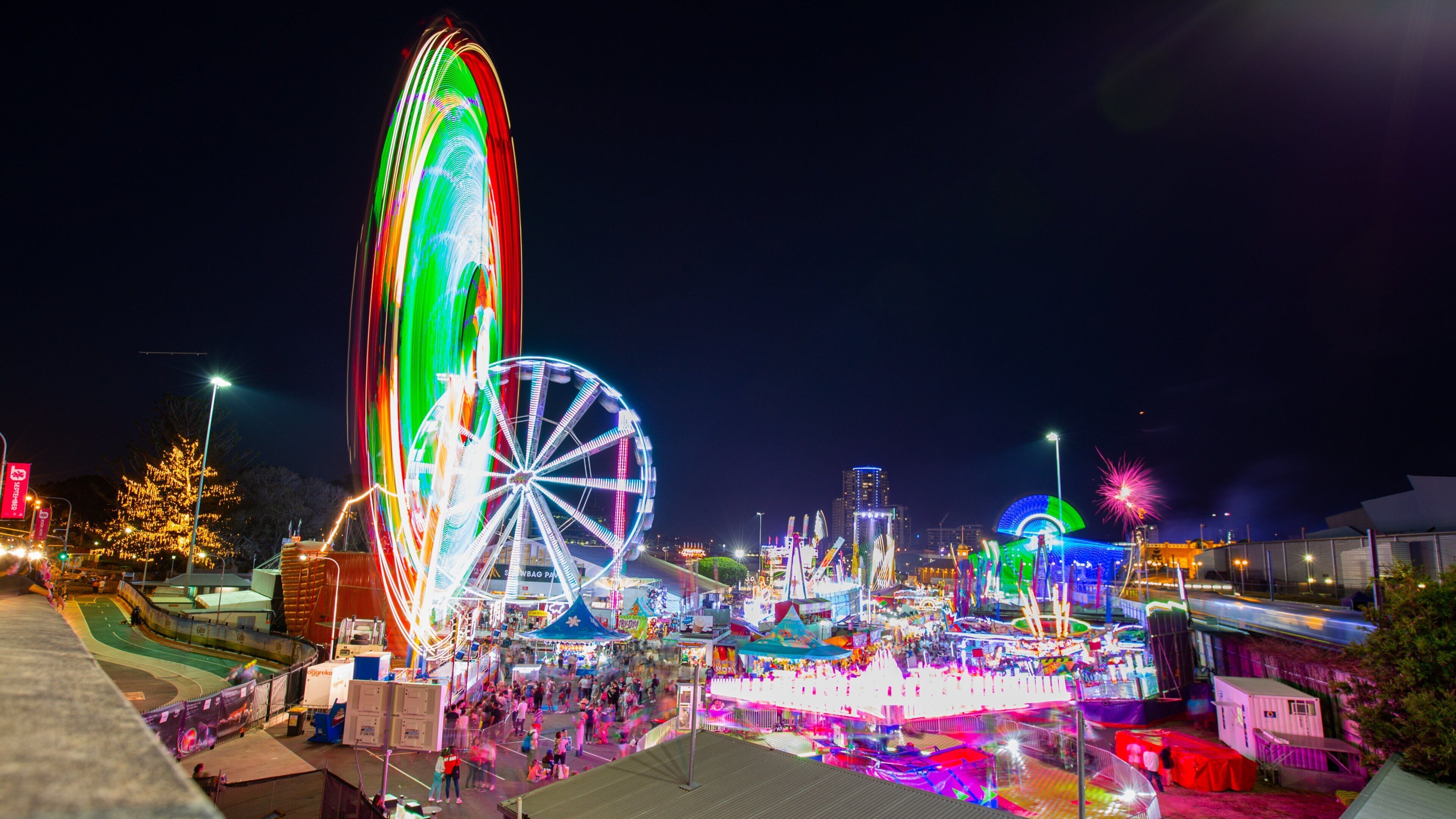 RNA Showgrounds featuring night scenes and rides