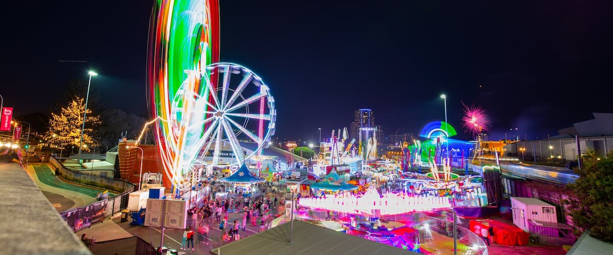 RNA Showgrounds featuring night scenes and rides