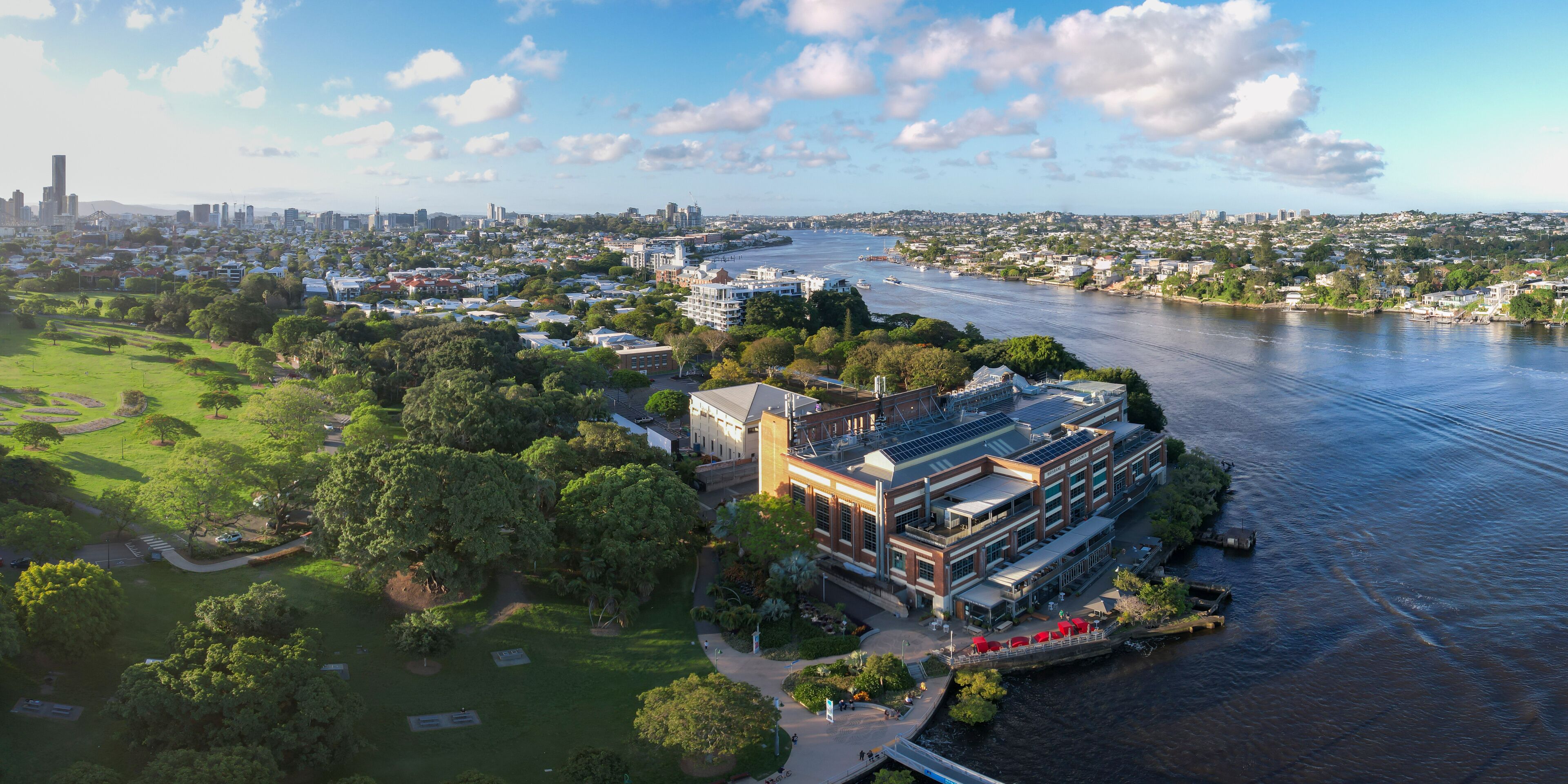 Aerial view of brisbane powerhouse and brisbane river with new farm park in an urban landscape, new farm, australia.