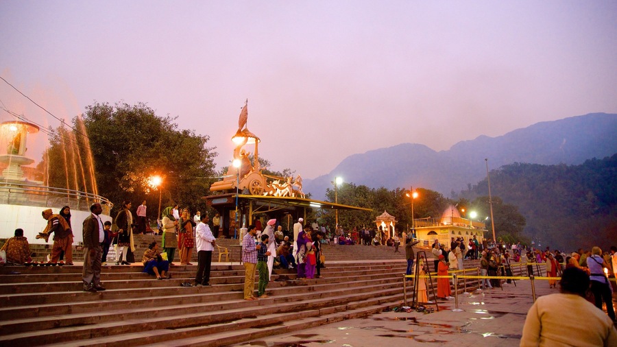 Triveni Ghat showing religious elements as well as a small group of people