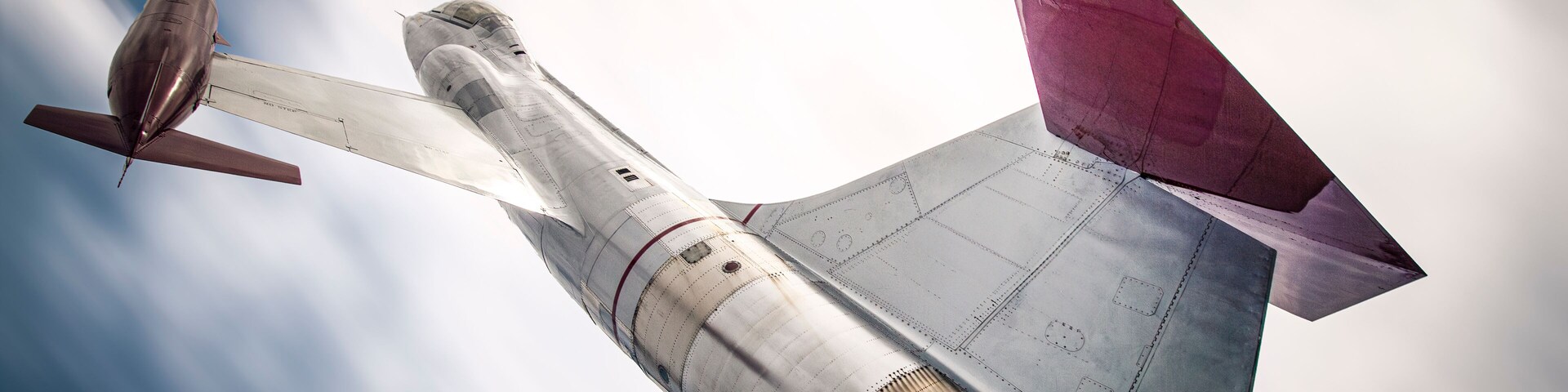 Backside of a CF-104 Starfighter jet against a blurry sky.