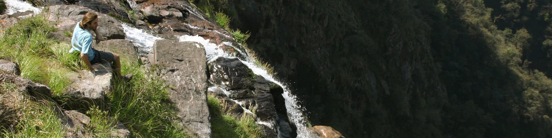 Tucuman which includes a waterfall as well as an individual male