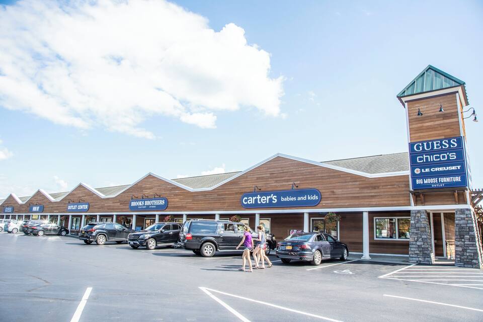 A shopping center with multiple stores including Carter's, Guess Chico's, and Big Moose Furniture.