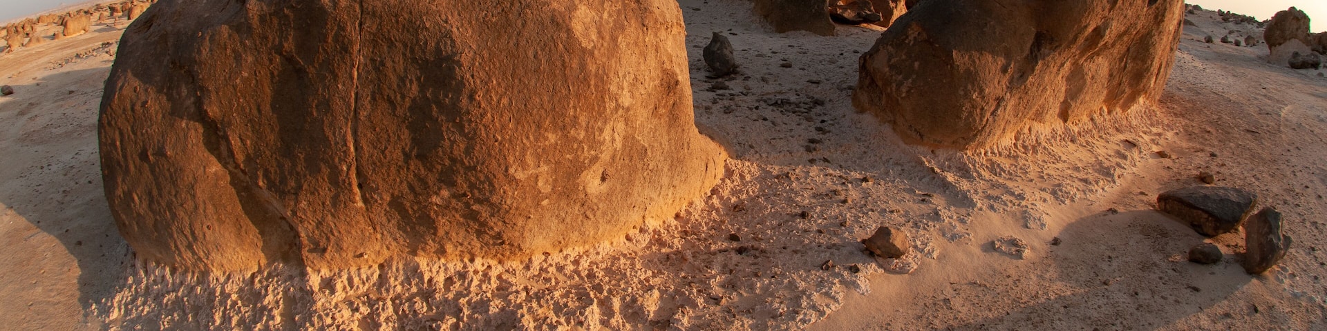 Large rock formations in a desert landscape.