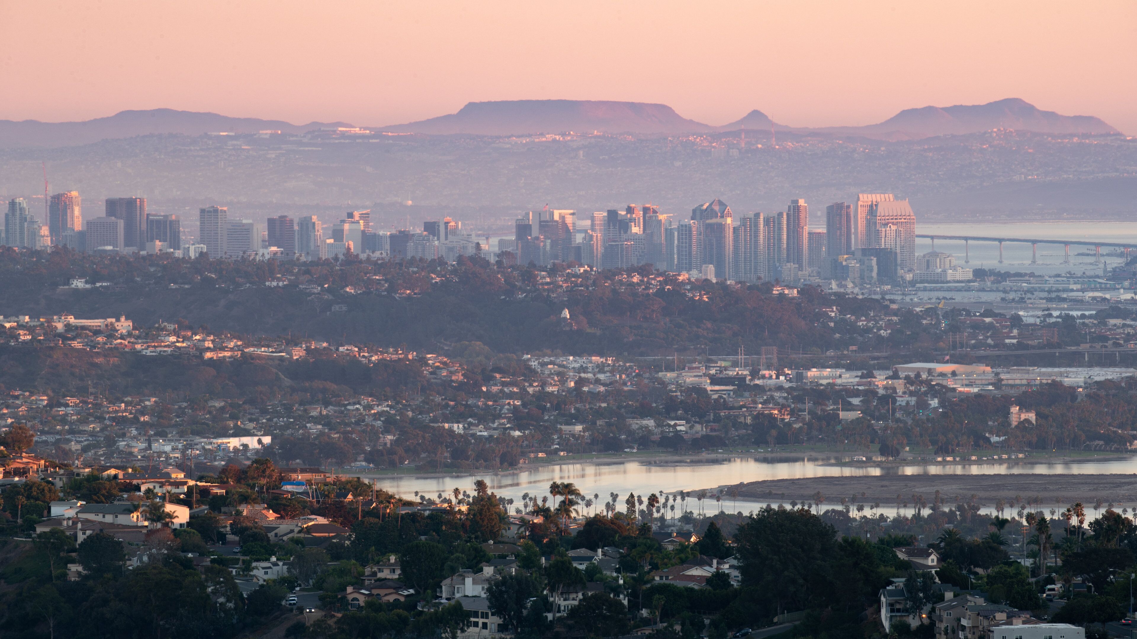 Mount Soledad showing a sunset, a city and landscape views