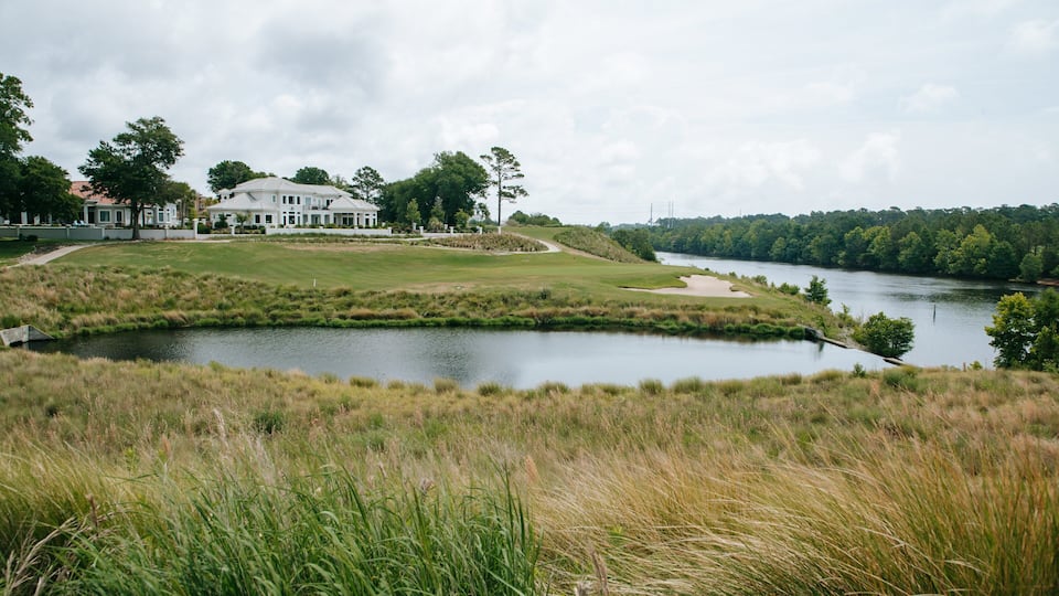 Grand Dunes Golf Course featuring a house and a river or creek