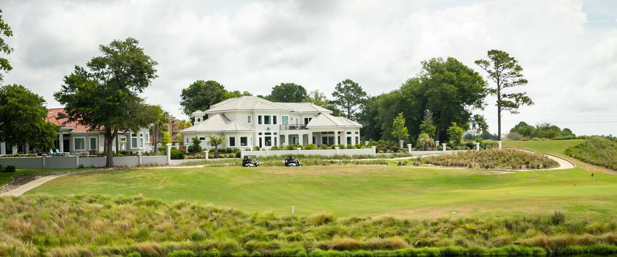 Grand Dunes Golf Course featuring a pond and golf