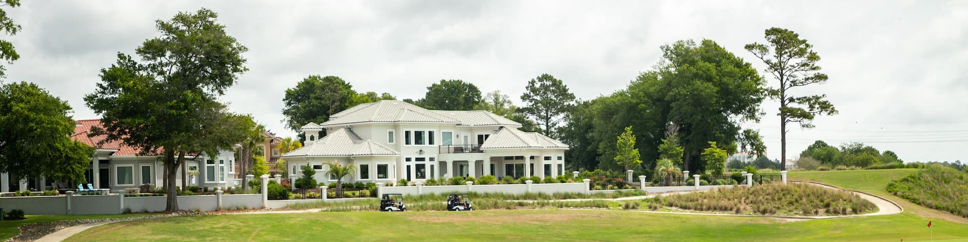 Grand Dunes Golf Course featuring a pond and golf