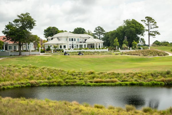 Grand Dunes Golf Course featuring a pond and golf