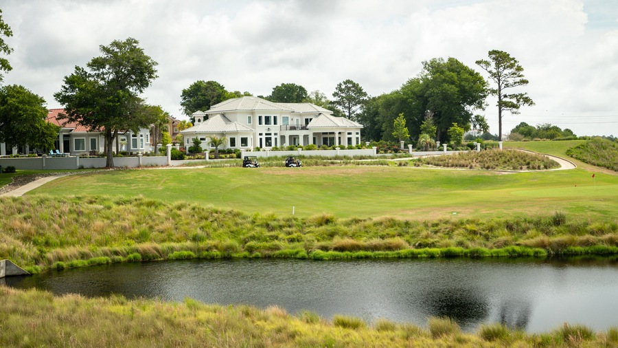 Grand Dunes Golf Course featuring a pond and golf