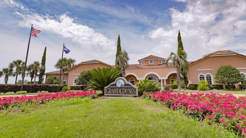 Grand Dunes Golf Course which includes signage and flowers