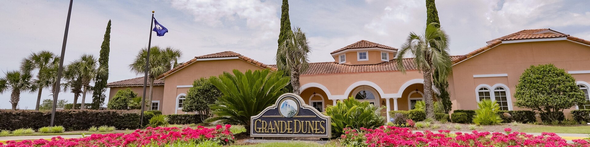 Grand Dunes Golf Course which includes signage and flowers