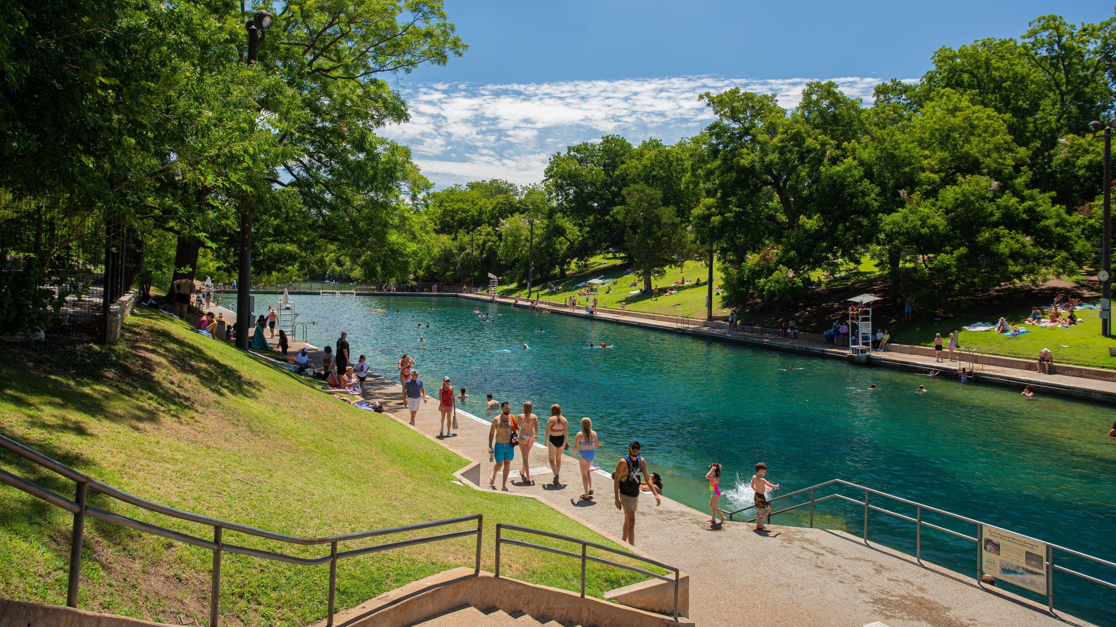 Barton Springs Pool which includes a garden and a river or creek