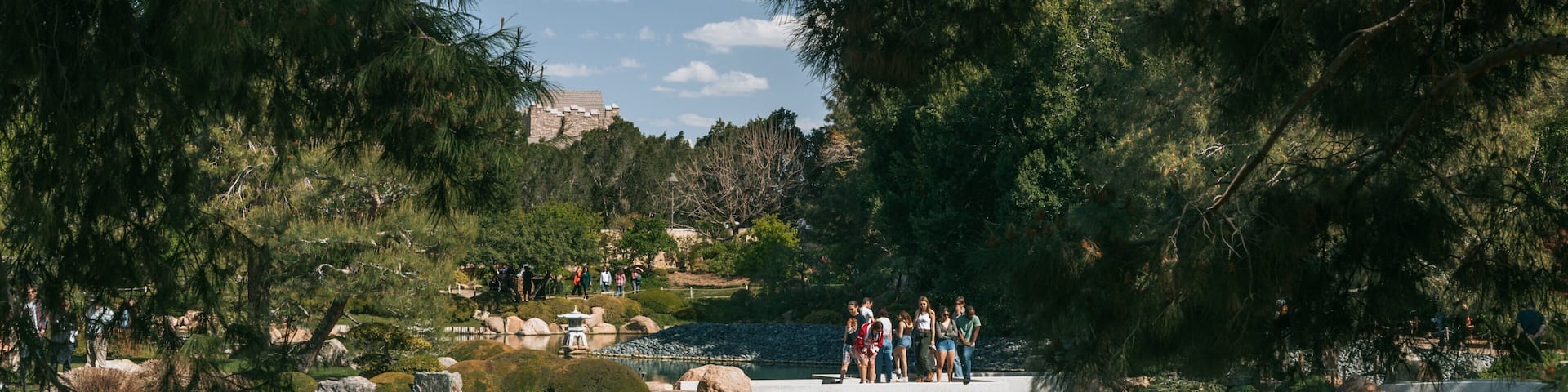 Japanese Friendship Garden of Phoenix which includes a pond as well as a small group of people