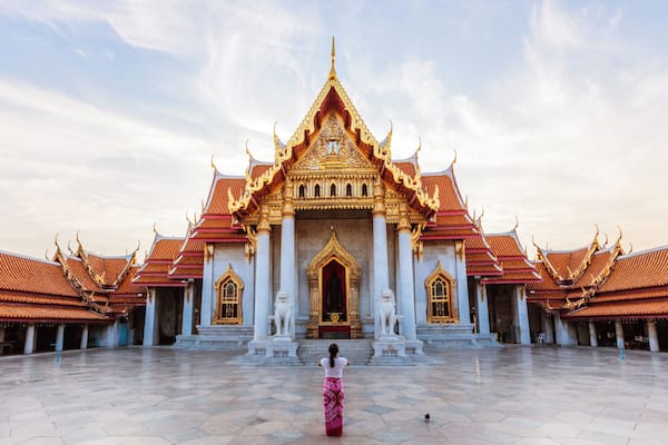Woman praying at Wat Benchamabophit, Bangkok