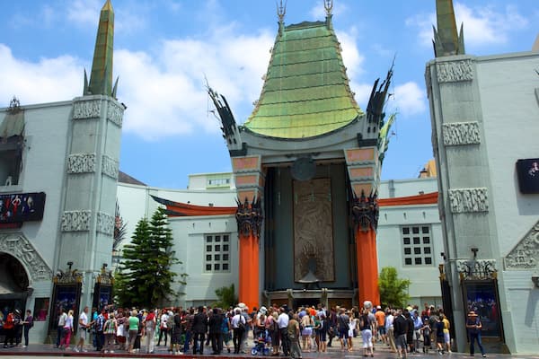 Hollywood Boulevard which includes a city and a square or plaza as well as a large group of people