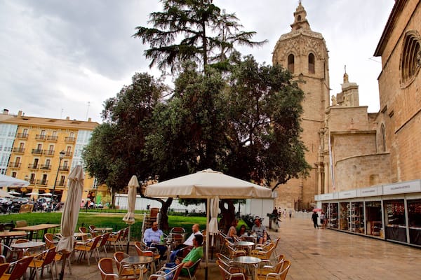 Miguelete Tower featuring outdoor eating and heritage elements as well as a small group of people