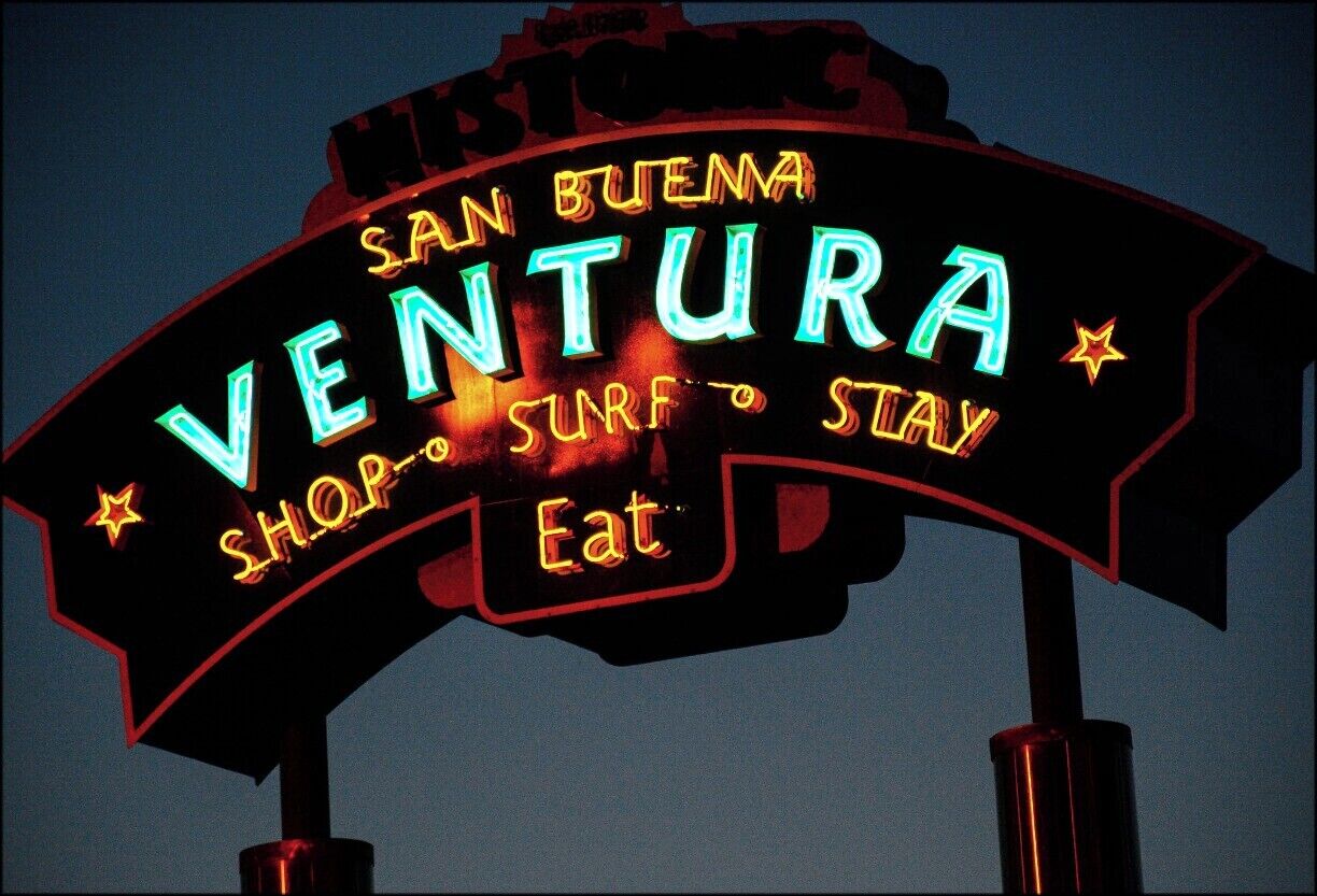 Sign welcoming you to Ventura, California. Ventura is a rare case of a city having two names. Its official name, according to the city itself, is San Buenaventura. The Post Office thought that was too long, so shortened it to Ventura, which was then adopted by the federal government. The sign tries to have it both ways.