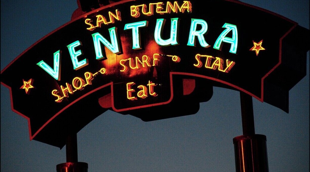 Sign welcoming you to Ventura, California. Ventura is a rare case of a city having two names. Its official name, according to the city itself, is San Buenaventura. The Post Office thought that was too long, so shortened it to Ventura, which was then adopted by the federal government. The sign tries to have it both ways.