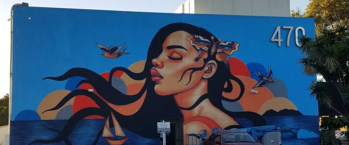 Artist is still working on this piece. Cool without that dump of a car in front of it!