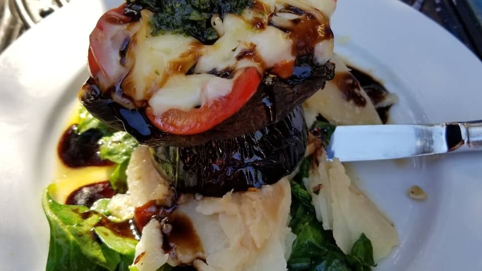 Amazing Napoleon! Basil pesto over smoked mozzarella over heirloom tomato over Portobello mushroom over potato au gratin over spinach! Love the dog friendly outdoor patio.