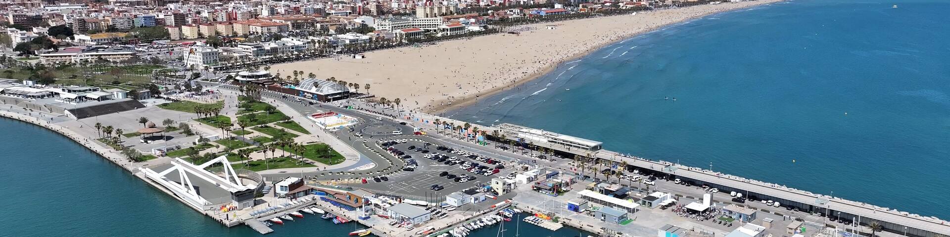 Las Arenas Beach At Valencia In Valencian Community Spain. Urban Beach. Bay Water Scenery. Downtown City. Las Arenas Beach At Valencia In Valencian Community Spain. Peaceful Landscape.