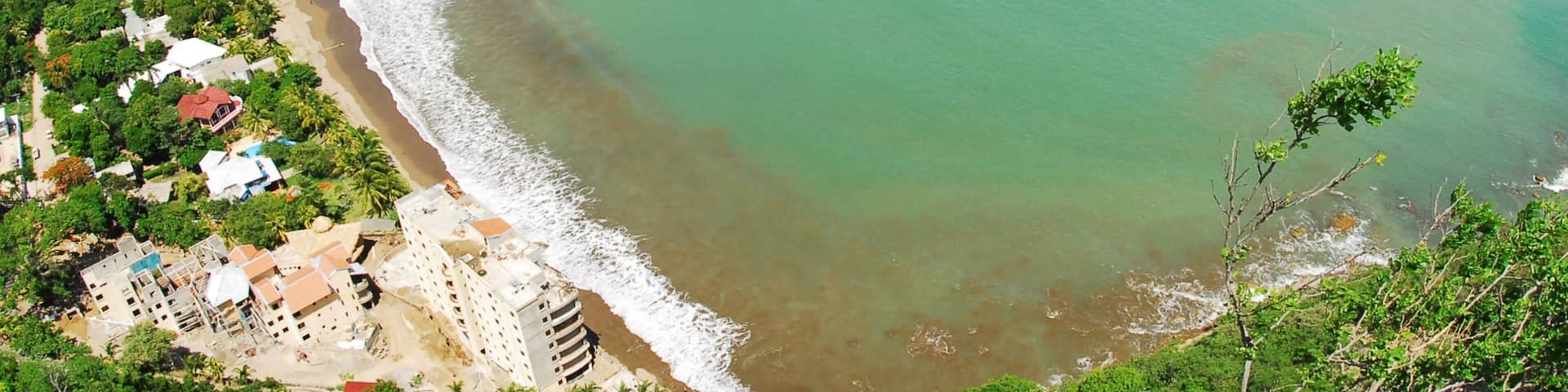 San Juan del Sur featuring tropical scenes, a bay or harbor and a sandy beach