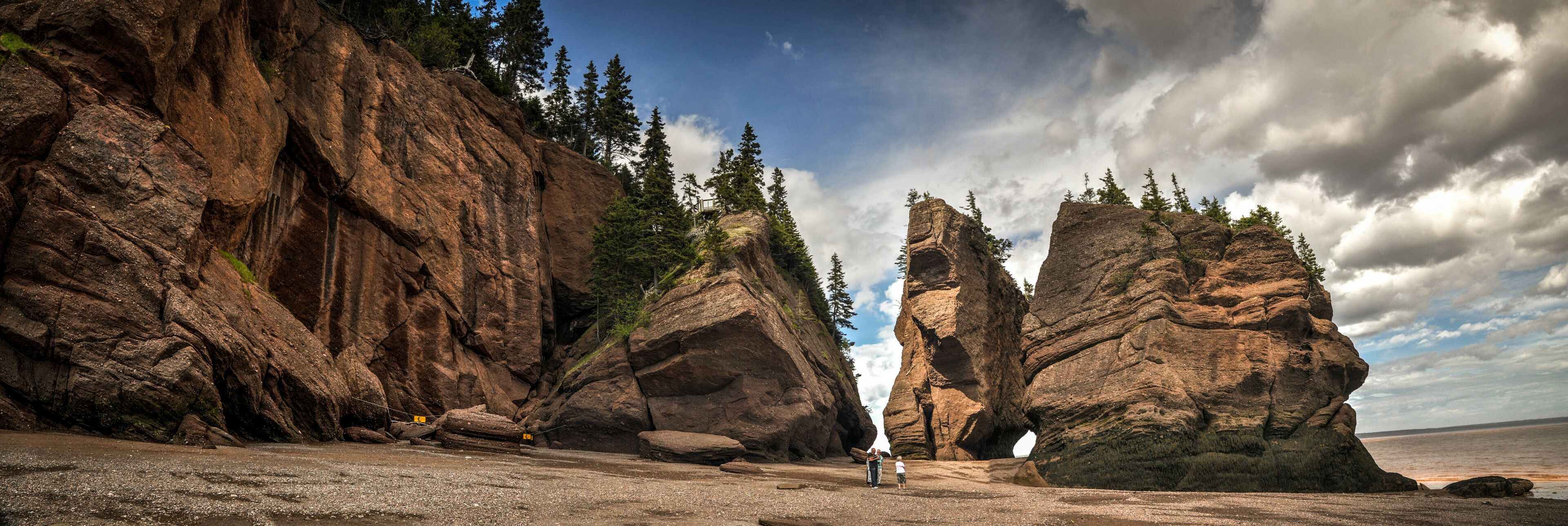 A rocky landscape with large rock formations and a clear sky.