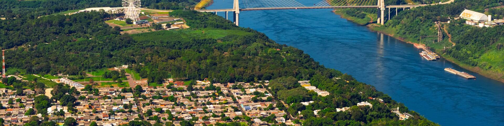 Aerial close up of Integration Bridge and Ferris wheel over Parana River at Brazil Paraguay border.