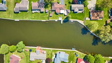 Aerial View of Suburban Riverside Homes with Docks, Warsaw, Indiana