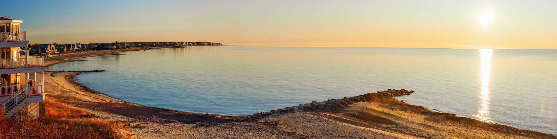 Sunrise over the Horizon and Beach Cove on Cape Cod, Massachusetts, a tranquil seascape of Falmouth Shoreline with a view of Martha's Vineyard in Atlantic Ocean