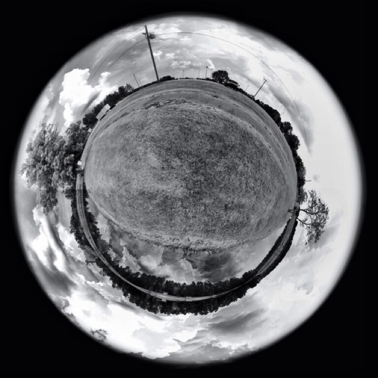 I call this smiling world. I Went out to the park and tried it, I think you all will enjoy it as well. I want to try it in an urban setting soon. I'm going to show you how to do this fun little trick. 

1) take a 360 degree panorama (any pano app).
2) take panorama and flip it, so sky is on bottom of picture.
3) either use polarizing filter in app or on computer, this will create circular effect.(pc/Mac: adobe PS is what I used, but I know most photo edit programs can do it.)
4) retouch, enjoy!