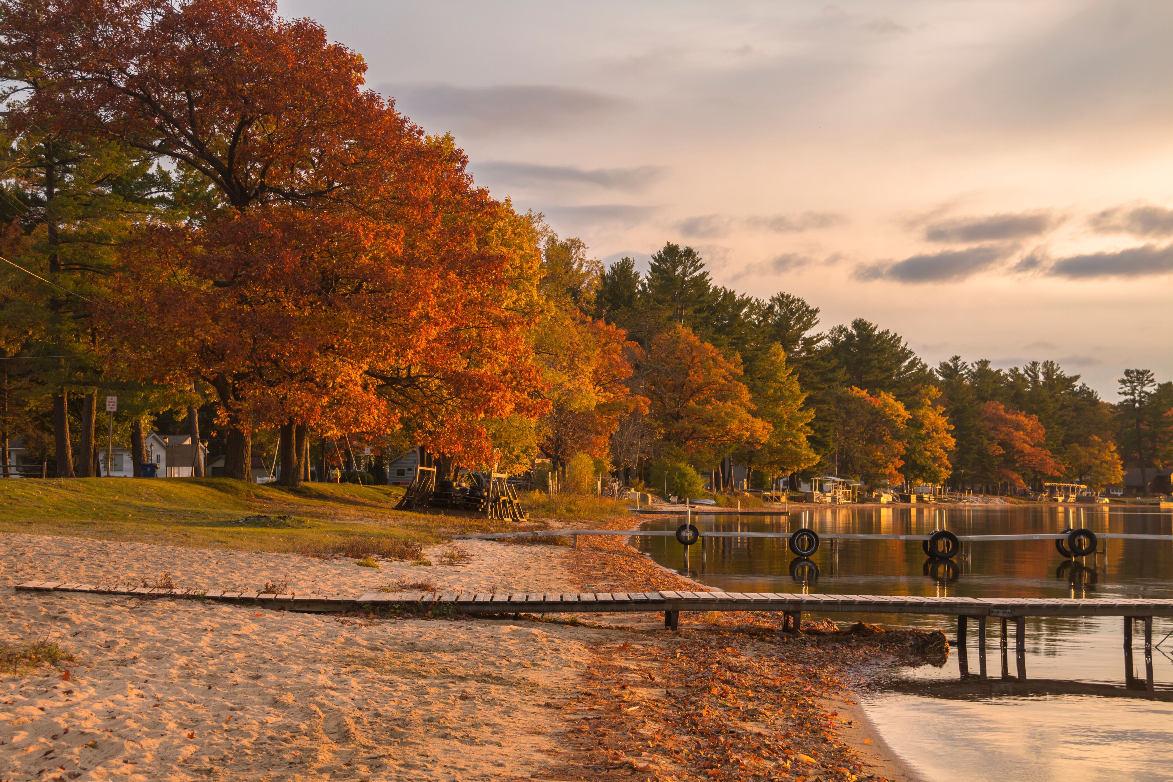 autumn trees beside a lake in Cadillac City in Northern Michigan.
