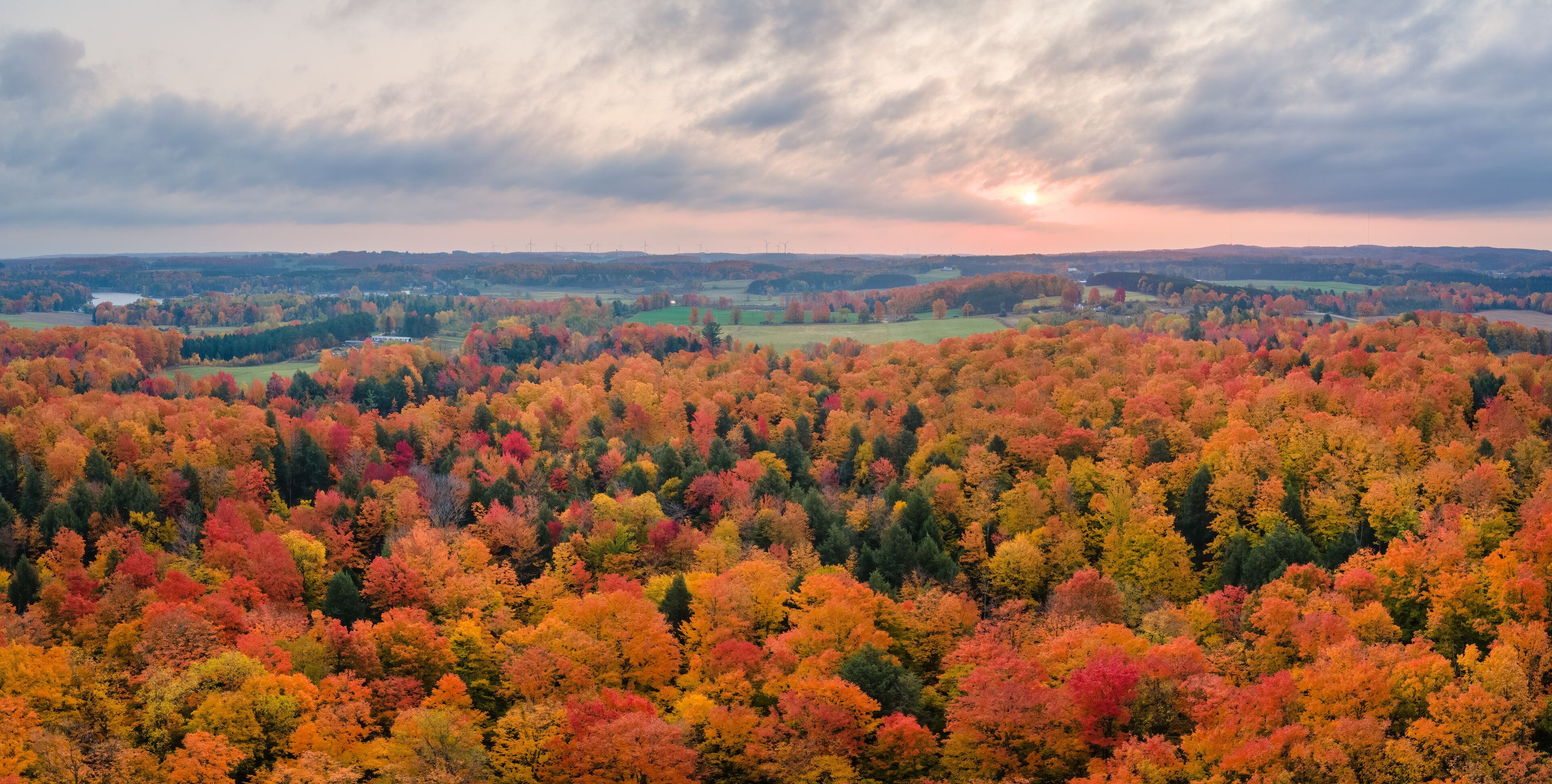 Sunrise  on a colorful scenic drive in autumn through the central Michigan countryside and farm land near Cadillac