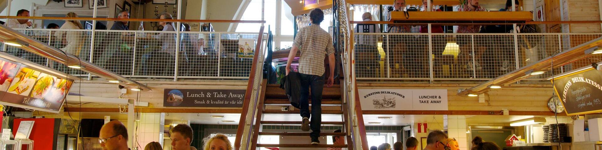 Fish Market showing interior views and markets as well as a large group of people