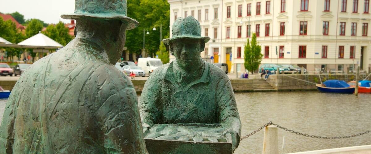 Fish Market showing a river or creek and a statue or sculpture