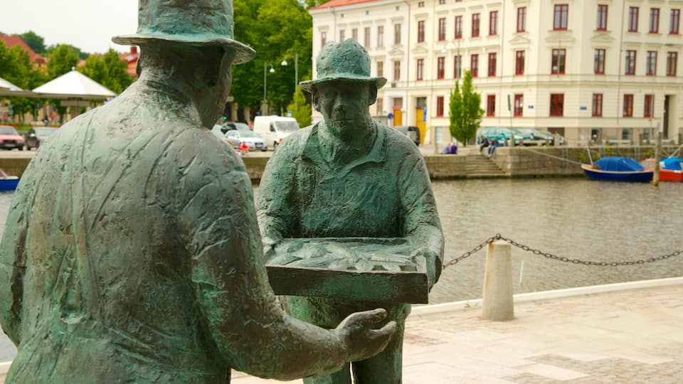 Fish Market showing a river or creek and a statue or sculpture