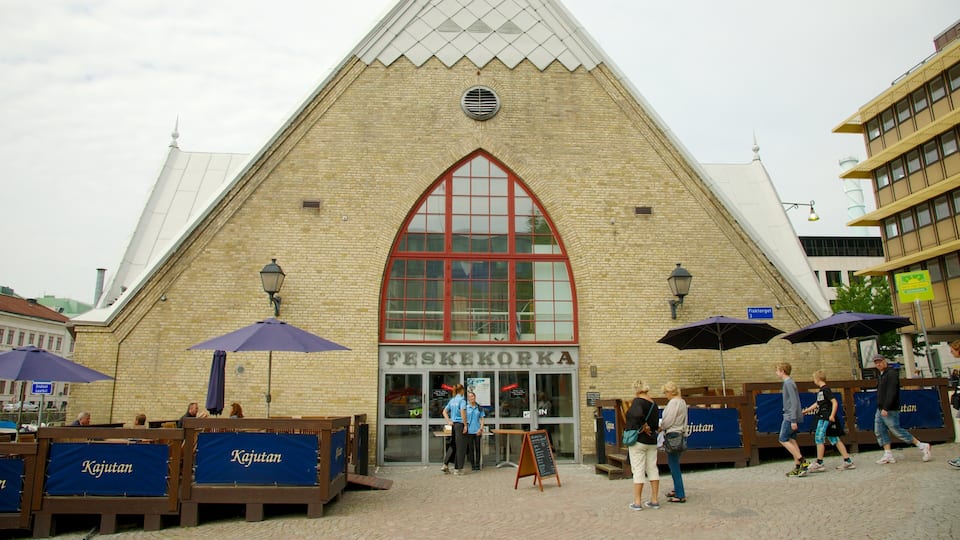 Fish Market featuring street scenes and markets as well as a small group of people