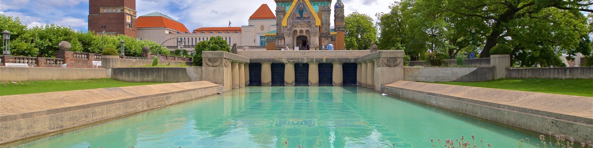 Russian Chapel featuring a park, a pond and heritage architecture