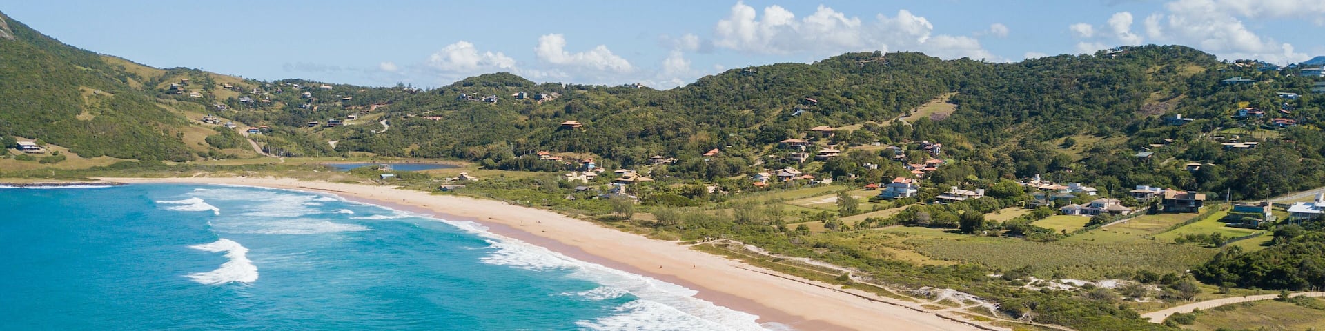 Aerial view of Silveira beach - Garopaba. Beautiful beach between mountains in Santa Catarina, Brazil