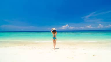 asian girl walking towards sea