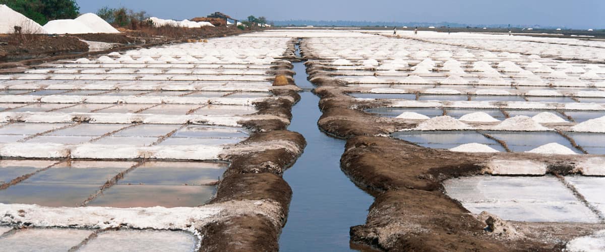 A salt flat with a central water channel.