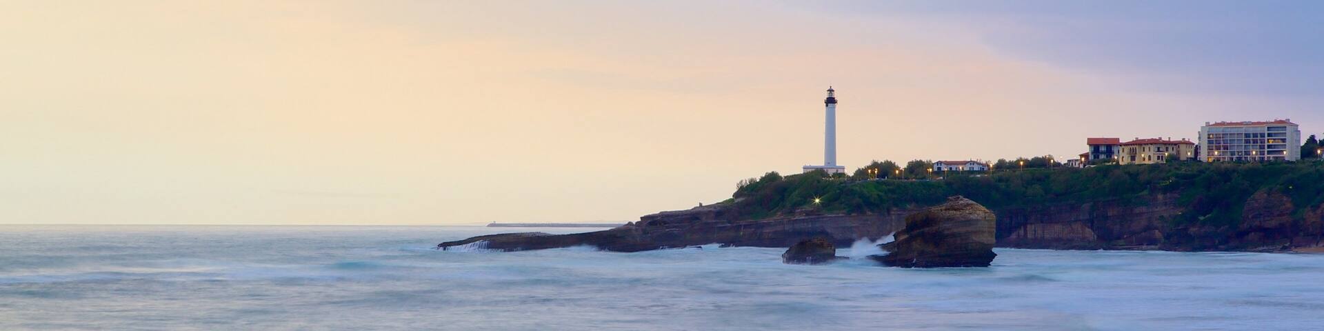 Aquitaine showing a lighthouse, general coastal views and a sunset