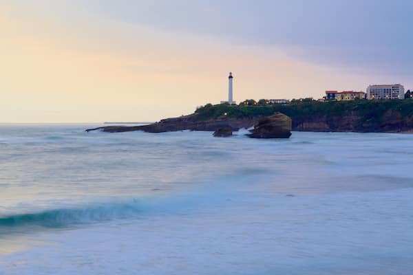 Aquitaine showing a lighthouse, general coastal views and a sunset
